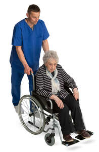 male nurse pushing an elderly lady in a wheel chair