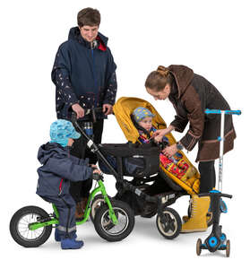 family with two kids and a stroller standing