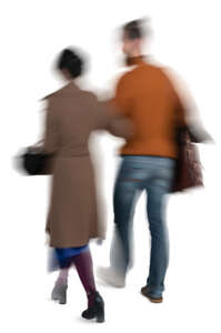 motion blur image of a couple walking arm in arm