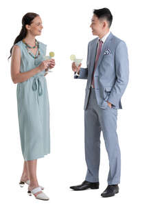 two people standing and drinking cocktails