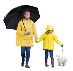 cut out mother and daughter and a dog walking in the rain