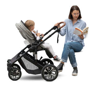 woman with a baby stroller sitting and reading a book