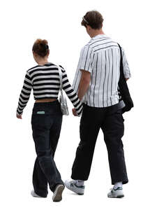 young trendy couple walking and holding hands