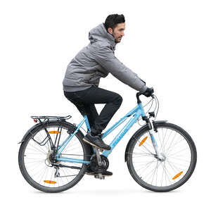 man in a grey jacket riding a bike