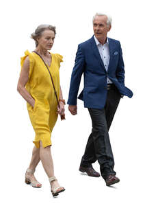 senior couple in formal outfits walking