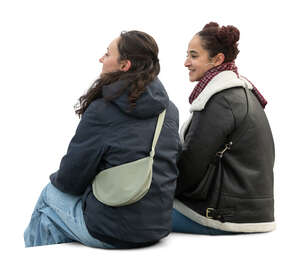 two women sitting outside