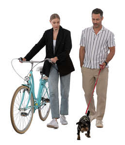 man and woman with a bike and dog walking