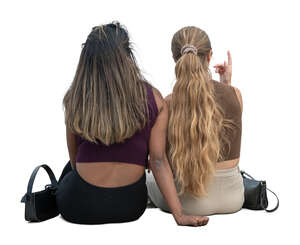 two cut out women sitting seen from back
