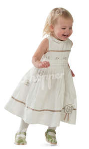 little girl in a white dress running and laughing