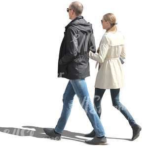 couple in spring coats walking arm in arm