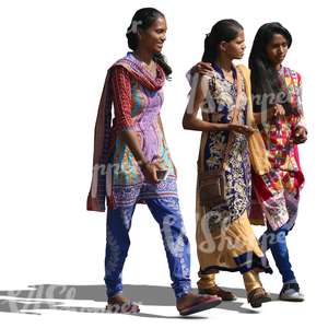 three young hindu women wearing traditional indian clothes walking and talking