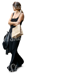 woman in a black outfit and carrying shopping bags