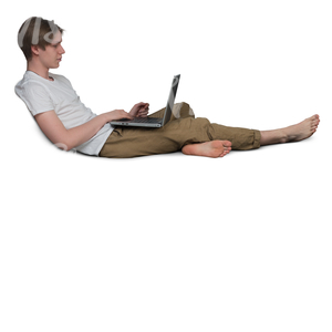 young man sitting on a couch and working with his laptop