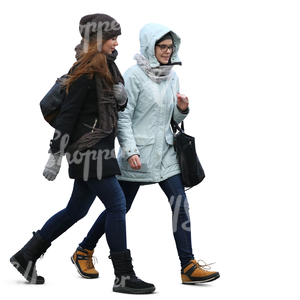 two teenage girls in winter coats walking side by side