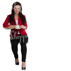 woman sitting at a cafe table and drinking coffee