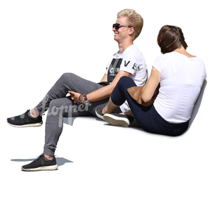 young man and woman sitting on a bench and laughing