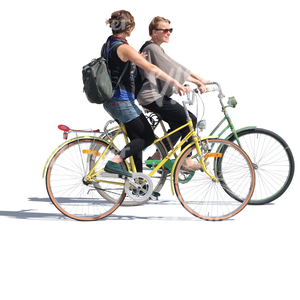 two women riding bikes side by side