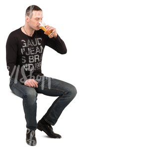 man sitting in a cafe and drinking beer