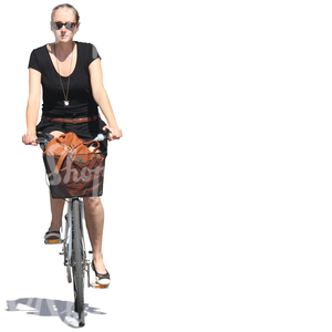 woman riding a bike in the summertime