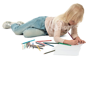 little girl lying on the floor and drawing
