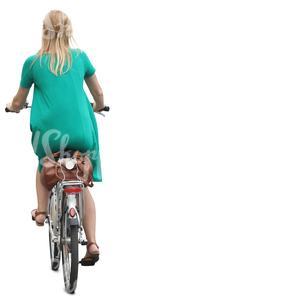 woman in a green dress riding a bicycle