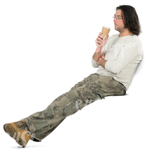 man sitting on a park bench and drinking coffee