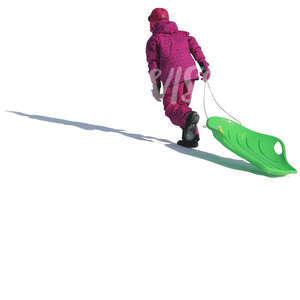 little girl with a sledge walking up the hill