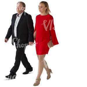 man and woman in formal clothing walking hand in hand