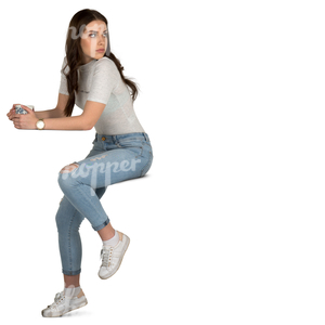 young woman siting in a cafe and drinking tea