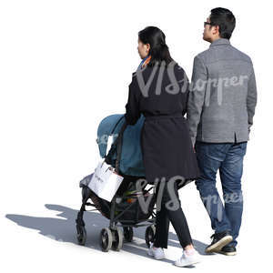 asian couple with a baby stroller walking on a sunny day