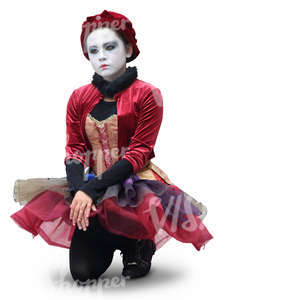 actress in a theatrical costume kneeling