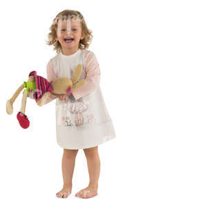little girl in a pink dress playing with her toy rabbit