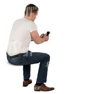 man sitting at the desk and texting