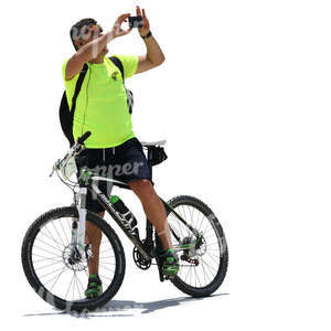 man with a bicycle taking a picture with his phone