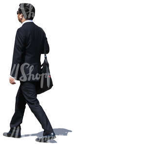 asian businessman in a black suit walking