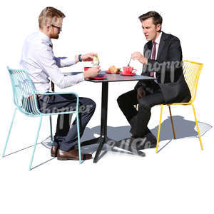 two businessmen having a lunch in a cafe