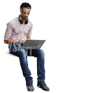 african man sitting and working with a laptop