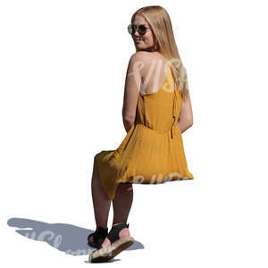 woman in a yellow dress sitting
