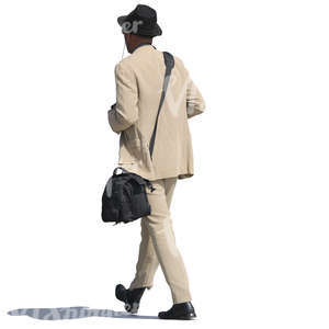 african man in a beige suit walking