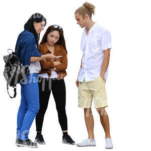 group of three people standing and looking at smth on the phone