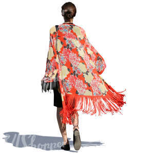 woman in a colorful jacket walking in sunlight