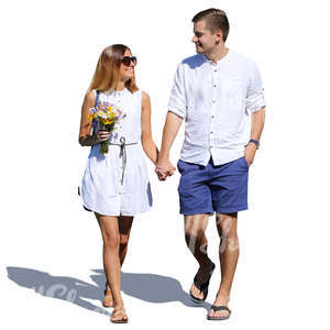 smiling couple walking hand in hand
