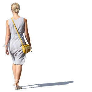 woman in a grey summer dress walking