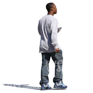 african man walking with a phone in his hand
