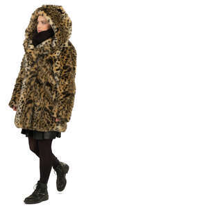 woman in a hooded fur coat walking