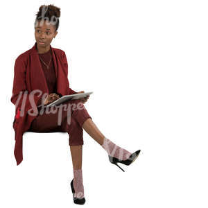 african woman sitting and working with tablet