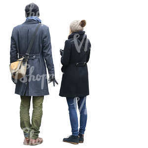man and woman in autumn coats standing