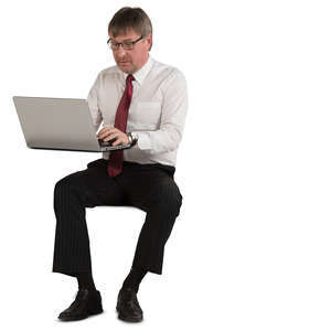businessman sitting and working with laptop
