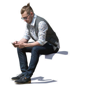 man sitting and texting