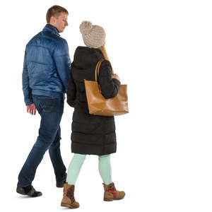 man and woman in winter coats walking